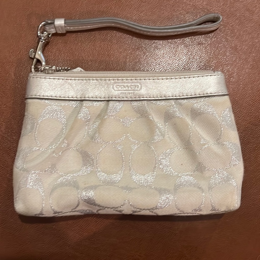 Coach silver small wristlet/wallet pouch.  Never used